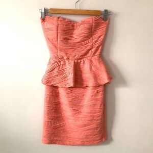 Mini strapless dress with built in bra, open back, stretch fabric, fully lined.